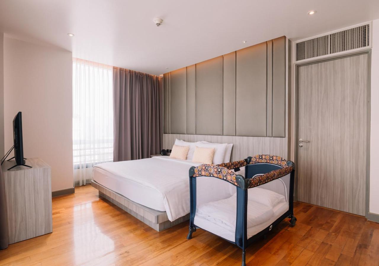 Fraser Suites Sukhumvit Bangkok Exterior foto A cot in a hotel room